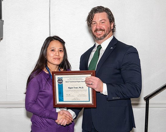 Ngon Tran, PhD, accepts the HTMAS Best Paper Award from December 2024 JANNAF Meeting Chair, Heath T. Martin, PhD.
